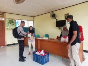 Polres Fakfak Kawal Distribusi 299 Paket Makanan Bergizi Gratis di Fakfak