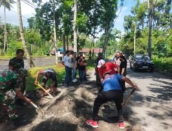 Peduli Keselamatan Pengguna Jalan, TNI, Polri dan Pemerintah Kecamatan Dimembe, Kerja Bakti Gerakan Indonesia Asri Timbun Jalan Berlubang di Ruas Poros Dimembe – Likupang